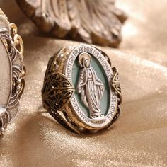 This ring is inspired by sentimental French jewelry, Our Lady, Mary, mother of Jesus, stands in an oval frame against a serene turquoise enamel background. It is inscribed with the verse of the Miraculous Medal. Virgin Mary Ring, Guadalupe Bracelet, Mary Mother Of Jesus, Religious Jewelry Catholic, Peacock Ring, Peacock Jewelry, Virgin Mary Necklace, First Communion Gifts, French Jewelry