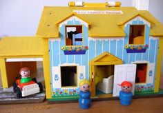 there is a toy house with two people in it