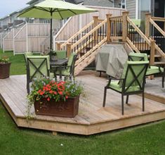 a deck with chairs and an umbrella over it