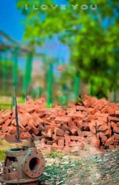 a pile of bricks sitting on top of a field