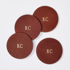 three personalized leather coasters with initials