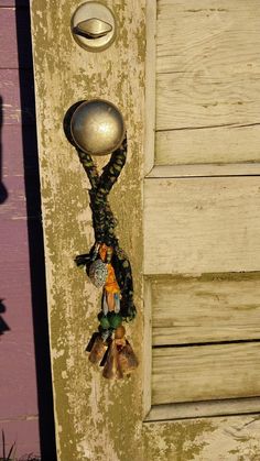 an old door handle with a bunch of stuffed animals hanging from it's side