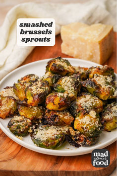 roasted brussel sprouts on a plate with parmesan cheese and bread