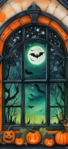 a window with pumpkins and bats on it in front of a full moon filled sky