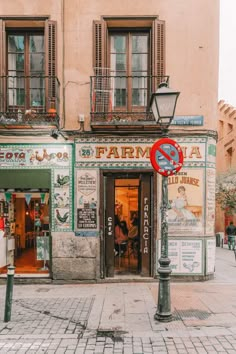 an old building with many signs on the front and side windows that say no parking