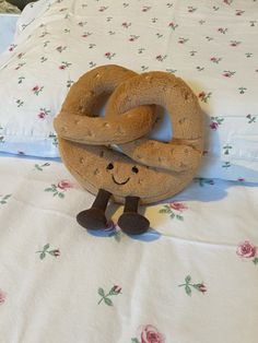 a stuffed pretzel is on the bed