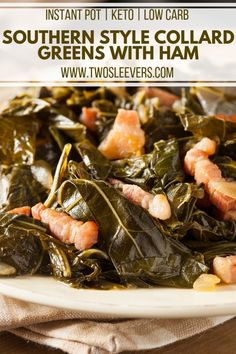 a white plate topped with collard greens covered in ham and other vegetables on top of a wooden table