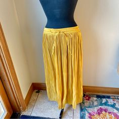 H&M Midi Skirt Satin Pleated Stretch Mustard Yellow Gold Nwt New With Tags. No Flaws Noted. Brand: H&M Midi Skirt Size Small Golden Yellow Color Elasticized Stretch Waistband With Drawstring Ties Silky Satin Texture Pleated Polyester Measurements Are Approximate With Item Laying Flat: Waist: 26” Unstretched, Stretches To 38" Length: 33” From A Smoke Free, Pet Friendly Home. Chic Yellow Skirt With Elastic Waistband, Mustard Bottoms With Elastic Waistband For Spring, Yellow Skirt For Workwear In Fall, Yellow Flowy Pleated Midi Skirt, Yellow Stretch Pleated Skirt, Yellow Pleated Stretch Skirt, Yellow High-waist Skirt For Summer, Yellow Pleated Skirt For Work, Summer Yellow Fitted Pleated Skirt