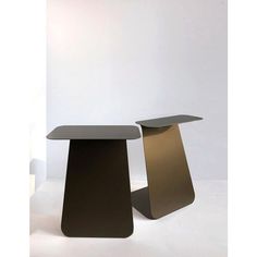 two black tables sitting next to each other