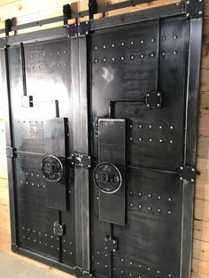 two large metal doors are on the wall