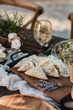 an assortment of food and wine on a table