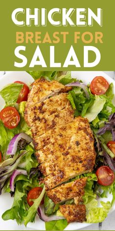 chicken breast for salad on a white plate with lettuce and tomatoes