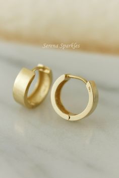 10k Solid Gold Huggie Hoop Earrings, Thick Gold Hoops, Real Gold Plain Huggie Hoops are For Everyday Minimalist Casual or Formal Look. Care for your sensitive ears Nickel free, Hypoallergenic Huggie Earrings, Comfortable to wear all Day. Metal: Solid Gold Gold Purity: 10k Stamp: 10k Dimensions: Thickness: 4mm Inner Diameter: 9mm Outer Diameter: 11.5mm Post Gauge: 0.85mm Weight for a Pair is approximately 2 Grams. BUYING OPTIONS Single Piece - Refers to 1 Individual Huggie One Pair - Refers to 2 Small Thick Gold Hoop Earrings, Luxury Elegant Hammered Huggie Earrings, Minimalist Adjustable Hoop Earrings For Anniversary, Minimalist Huggie Hoop Earrings For Anniversary, Cheap Gold-plated Huggie Earrings, Everyday Gold-plated Huggie Earrings, Modern Gold-plated Huggie Earrings, Hypoallergenic Gold-plated Huggie Jewelry, Durable Chic Gold-plated Huggie Earrings