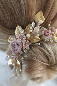 a close up of a woman's hair with flowers on it