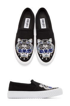 Kenzo Black Tiger K-Skate Slip-On Sneakers. Canvas slip-on sneakers in black. Round toe. Logo graphic embroidered in blue and grey at vamp. Elasticized gusset at sides of tongue. Padded collar. Blue And Grey, Slip On Sneakers