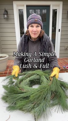 a woman is making a simple wreath out of pine needles and other greenery leaves