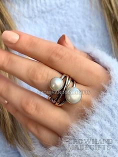 Description : Pearl Stone Cross Silver Ring, Pearl Silver Ring, Pearl Ring, 925 Sterling Silver Ring, Authentic Ring, Mother Day Ring, christmas day gift pearl ring, Five Stone Ring, coral pearl ring, mother of pearl ring, 925 silver pearl, pearl silver ring, sterling silver ring, white pearl ring, freshwater pearl, mother of pearl, multi stone ring, pearl ring silver, silver pearl ring Handmade item Materials: Pearl , Silver Gemstone: Pearl,  Gem color: White Band color: Silver/Gold Style: Minimalist Recycled Rose Gold Sterling Silver Crystal Ring For Anniversary, White Sterling Silver Pearl Ring, White Pearl Sterling Silver Ring, Rose Gold Sterling Silver Stackable Open Rings, Rose Gold Sterling Silver Open Stackable Rings, Silver Sterling Pearl Ring, Unique Sterling Silver Pearl Promise Ring, Adjustable Sterling Silver Pearl Ring For Everyday, Nickel-free Fine Jewelry Rings For Anniversary