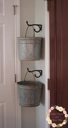 two buckets are hanging on the wall