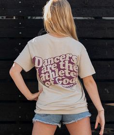 a woman in short shorts and a t - shirt with the words dancer's are the athletes of god on it