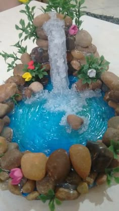 a fountain made out of rocks and water