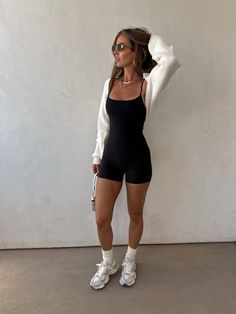 A black one piece romper in premium stretch athletic material adjustable tank straps outside seam detail down the center for added snatching Shrug Outfit Ideas Casual, Shoulder Shrug Outfit, Bolero Shrug Outfit, Modest Athletic Outfits, Shrug Outfit, College Outfits Aesthetic, Tennessee Outfits, Knitted Shrug, Romper Fall