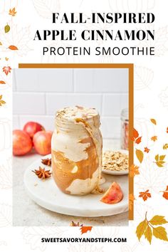 an apple cinnamon protein smoothie in a mason jar on a white plate with autumn leaves