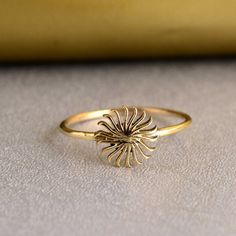 a gold ring sitting on top of a table