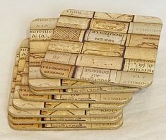 a pile of wine cork coasters sitting on top of a table