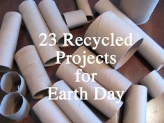 several rolled up toilet paper sitting on top of a wooden table with the words, 23 recycled projects for earth day