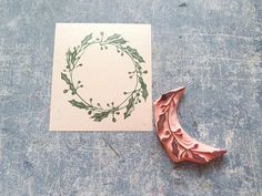 a piece of paper that is laying on the ground next to an ornament