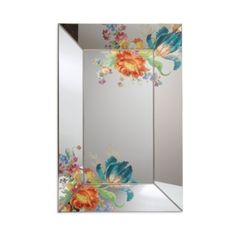 a mirror that has flowers painted on it