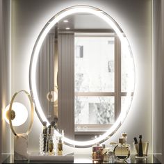 a bathroom with a large round mirror on the wall next to a sink and counter