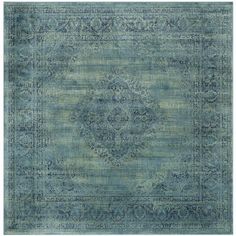 a blue rug with an ornate design on the top and bottom, it is very soft