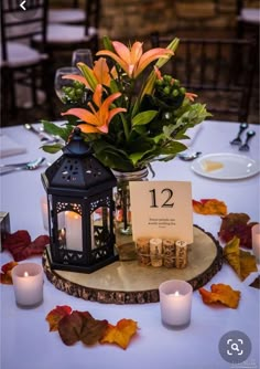 the table is set with candles and flowers