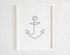 a black and white drawing of an anchor on a white wall with the letter o