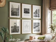 a living room with green walls and pictures on the wall