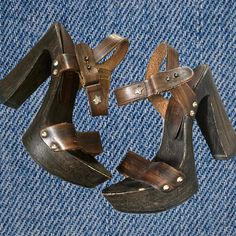 Rare and stunning "Replay" wood heels sandals from the end of the 90's/00s. a real unique and well-made piece of an era. Leather party clogs with a beautiful wooden look and fun decorative ankle closures.  straps are made of genuine leather, curvy heels are made from fine wood and rubber soles Made in Italy.  Size: 36 EU. Heel:  12 cm /4.7"  The sandals are in good used vintage condition, but there are some signs of wear and age, It looks like they had some fun :) but there is still such chic we Wooden Platform Heels With Closed Toe, Wooden Closed Toe Platform Heels, High Heel Wooden Platform Clogs, Wooden Round Toe Heels With Stacked Heel, Wooden Heels With Stacked Heel And Round Toe, Wooden Stacked Heel Round Toe Heels, Wood Stacked Heel Round Toe Heels, Open Toe Wooden Platform Clogs, Closed Toe Heels With Wooden Heel