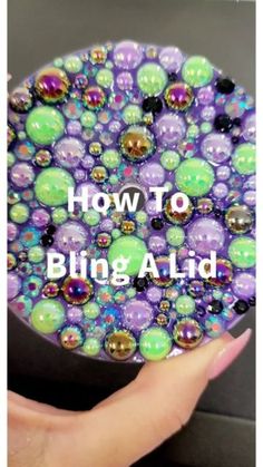 a hand holding a purple and green object with the words how to bling aid on it