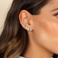 Elevate your elegance with these Lab Grown Diamond Pear Stud Earrings. Set in 14K gold or 14K white gold, each earring showcases a pear-shaped brilliant-cut lab diamond with a color grade of G and clarity of VS1. Available in a range of carat sizes from 0.25 CT to 2 CT, these earrings offer timeless sophistication and sparkle. Featuring post backs, they are sold as a pair and require 12-18 business days to be produced, ensuring each pair meets the highest standards of quality and craftsmanship. Pear Diamond Studs, Pear Shaped Jewelry, Pear Shape Earrings Studs, Second Ear Piercing, Carat Sizes, Heavy Jewelry, Diamond Anklet, Diamond Earrings For Women, Multiple Earrings