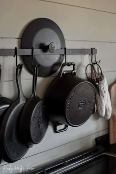 pots and pans are hanging on the wall