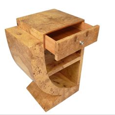 a wooden table with two drawers on each side and an open drawer in the middle