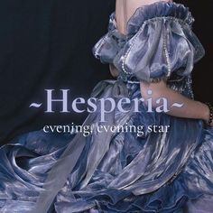 a woman in a blue dress is posing for the cover of her book, hesperia evening evening star