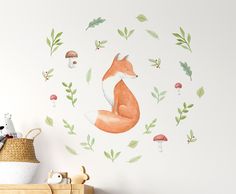 a wall decal with an orange fox surrounded by green leaves and mushrooms on it