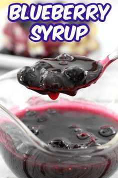 a spoon full of blueberry syrup with the words just 3 ingredients