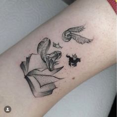 a tattoo on the arm of a woman with an owl and bird flying over her head