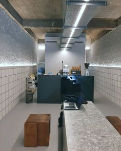 an empty room with laptops and other items on the counter