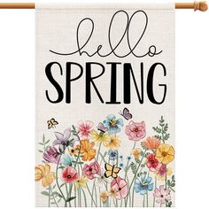 a garden flag that says, hello spring