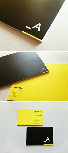 some black and yellow business cards on top of each other with the letter a in them