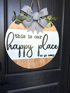 this is our happy place door hanger on the front door to give as a welcome sign