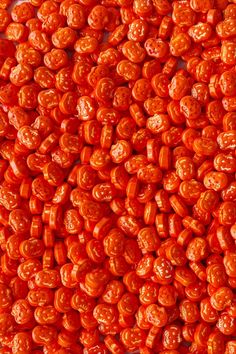 close up view of red beans on white surface